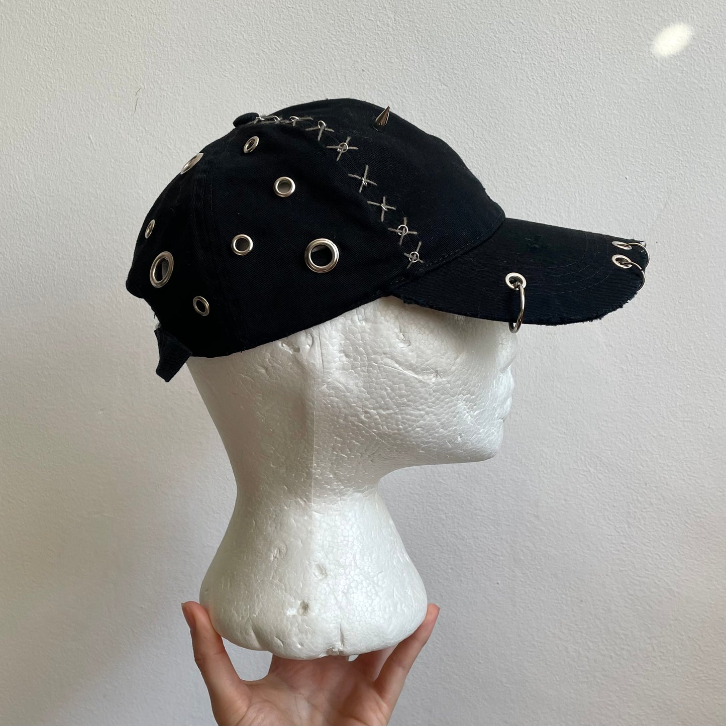 Black eyelet cap
