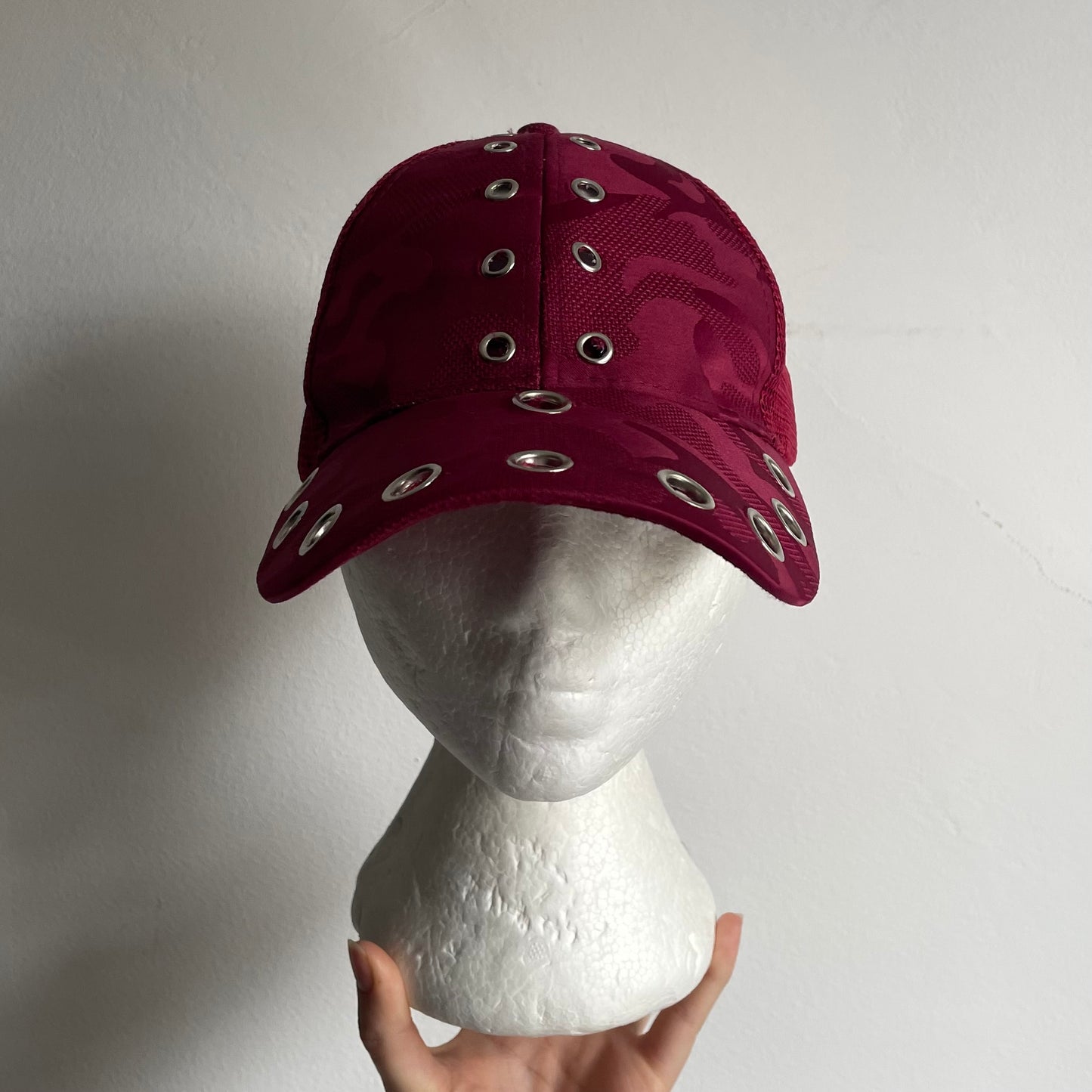 Eyelet trucker cap