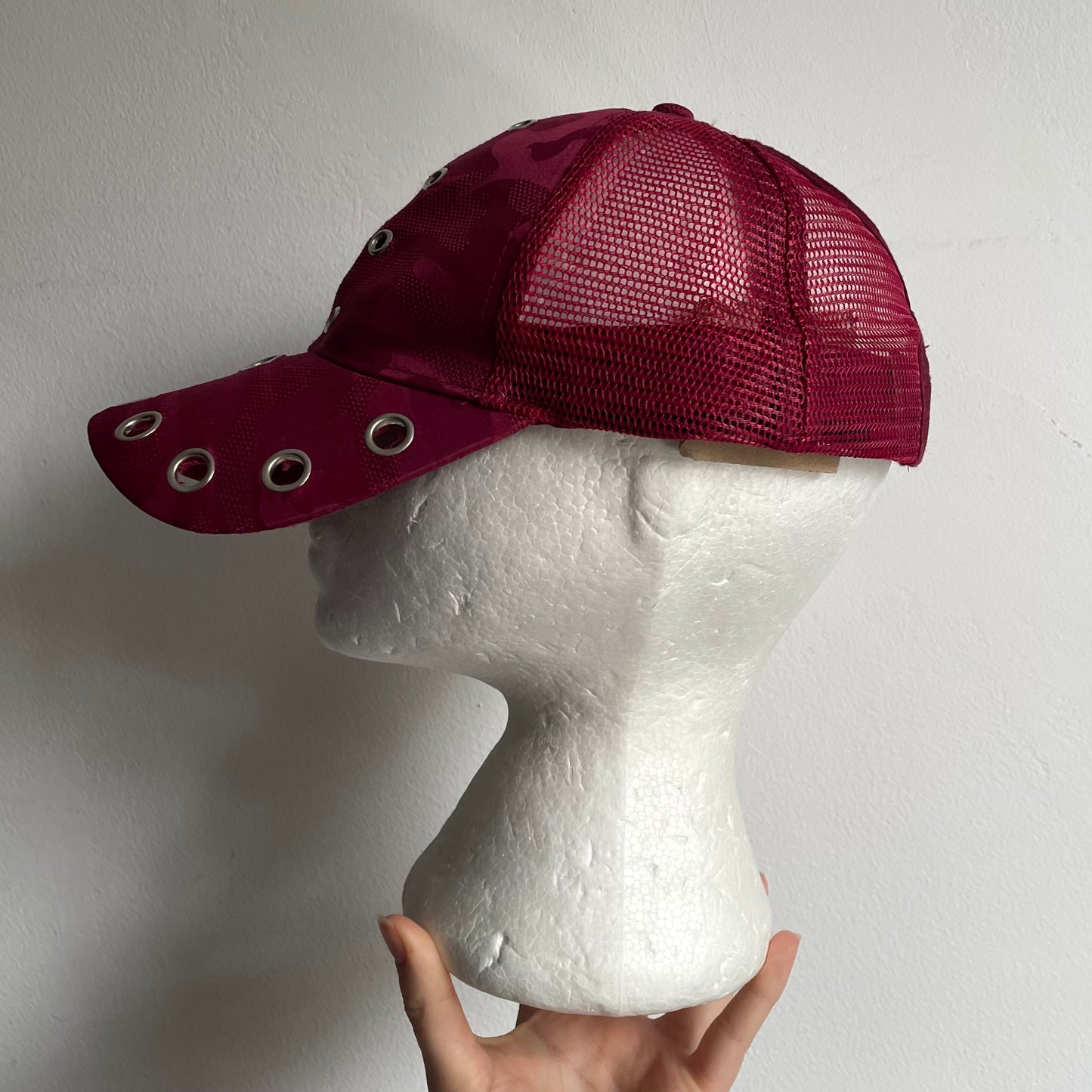 Eyelet trucker cap