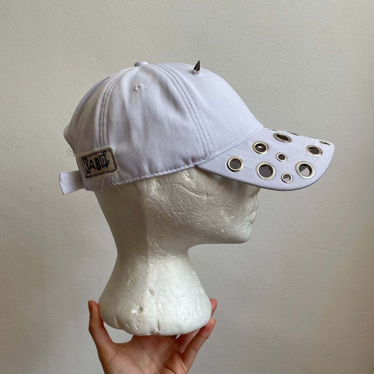 White eyelet cap