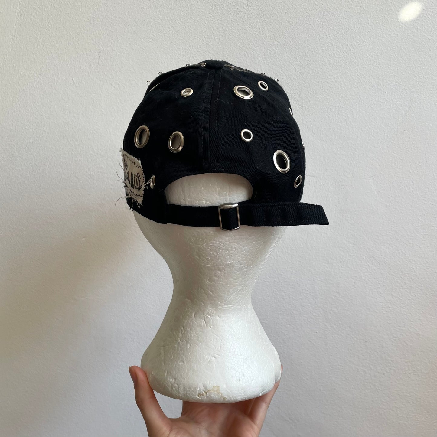 Black eyelet cap