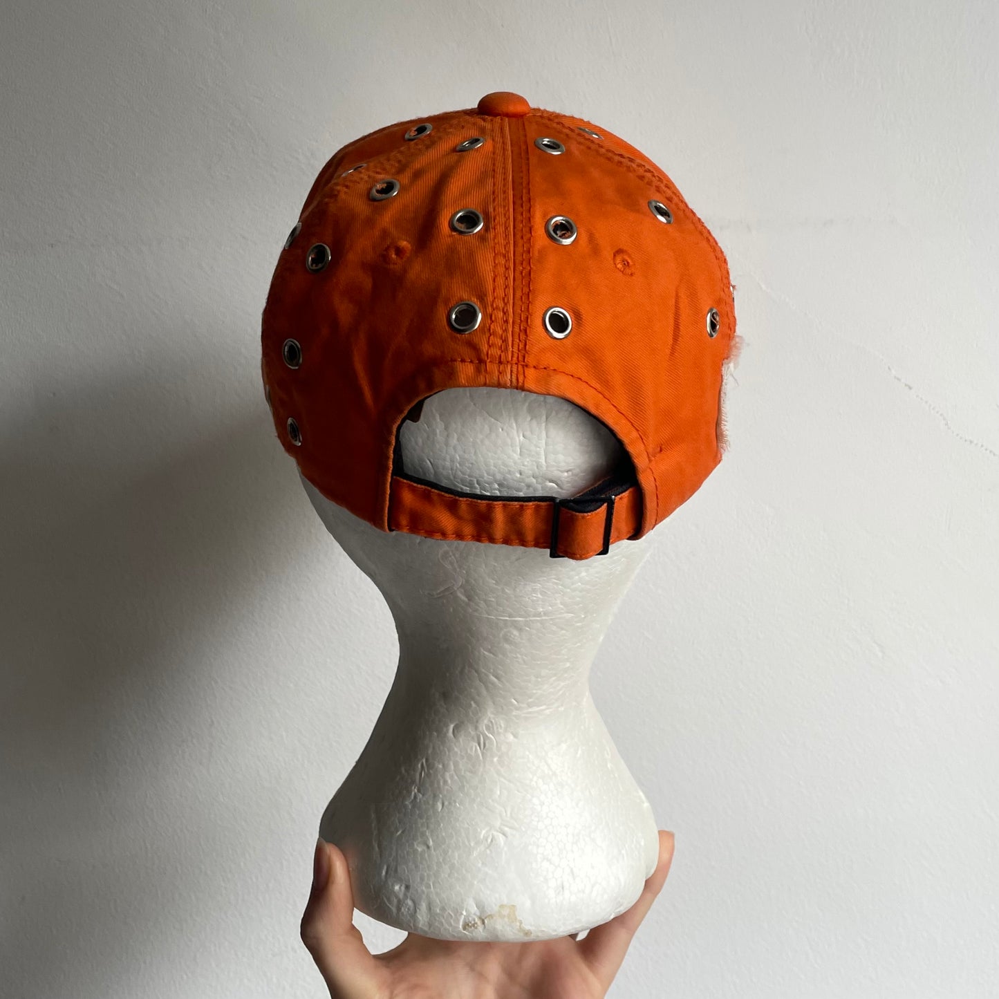 Orange eyelet cap