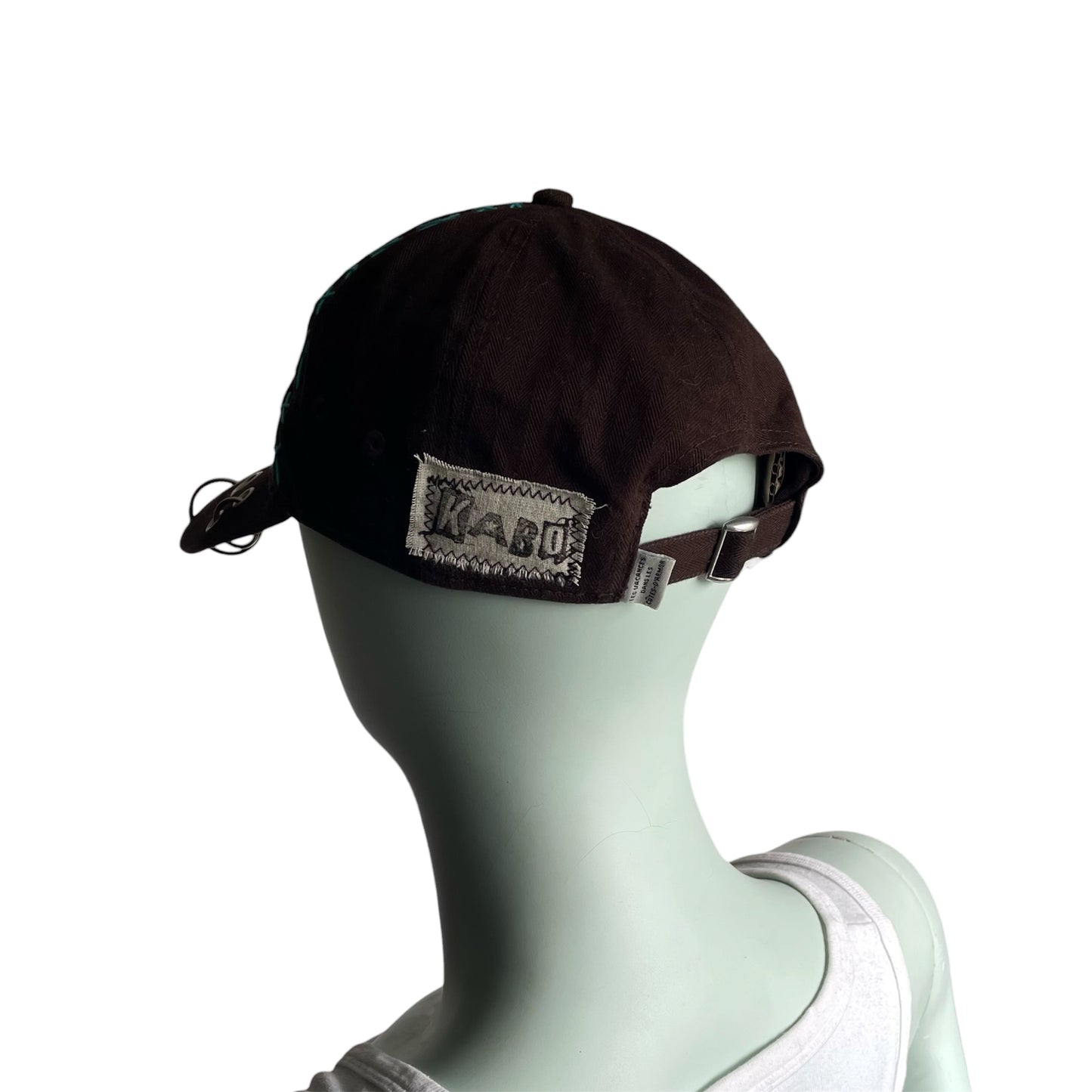 Brown cross stitch cap