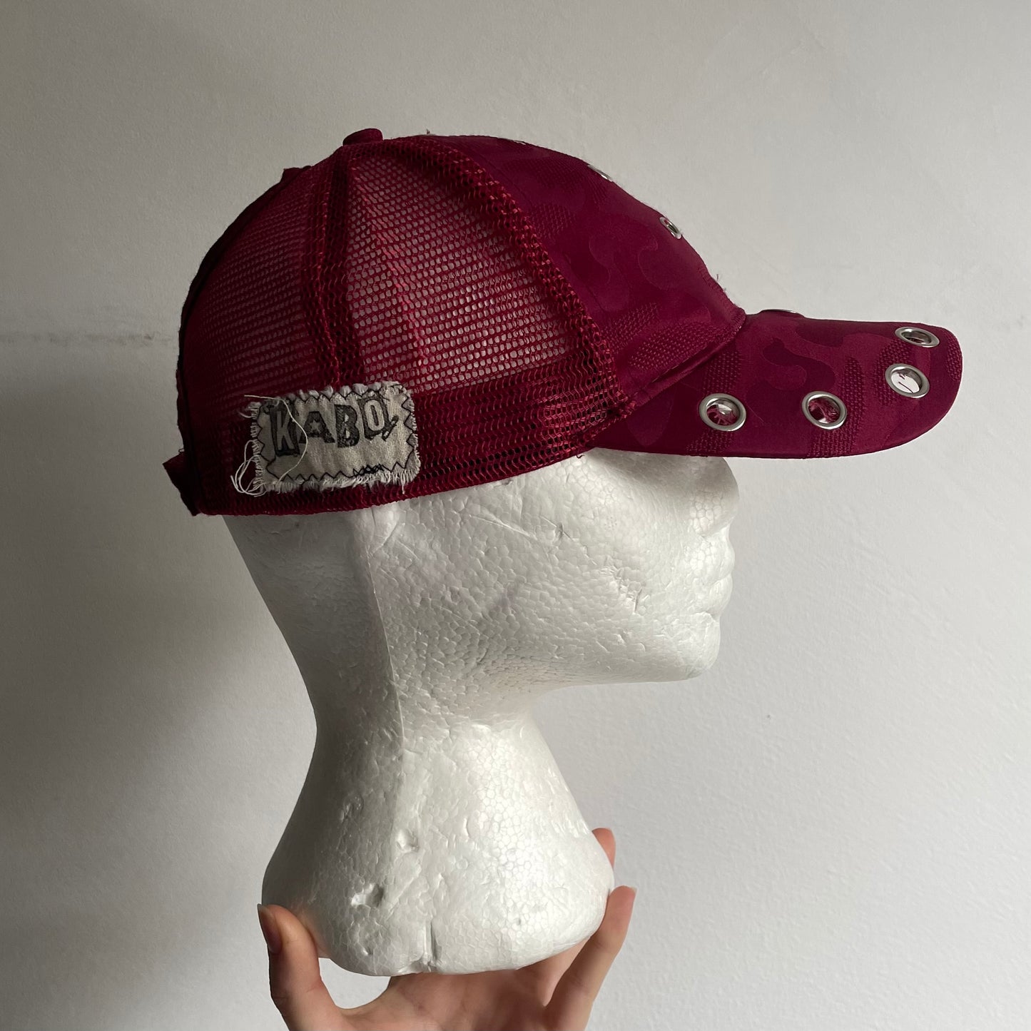 Eyelet trucker cap