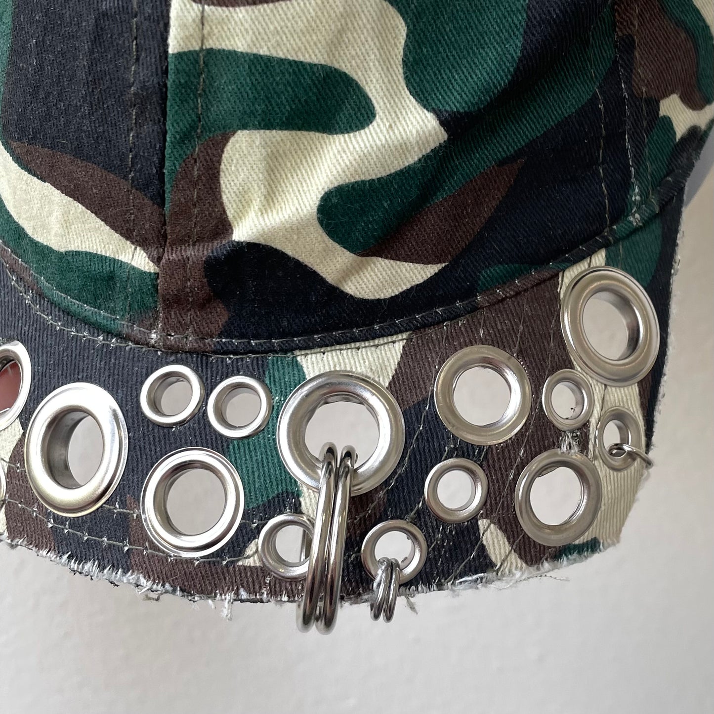 Camo eyelet brim cap