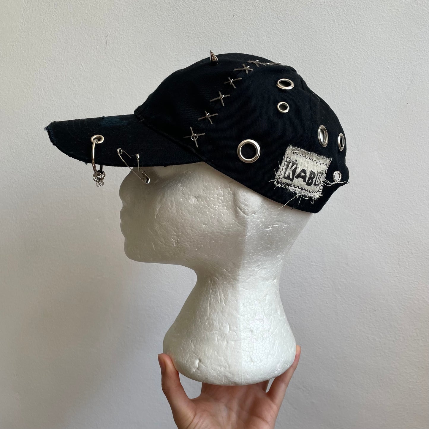 Black eyelet cap