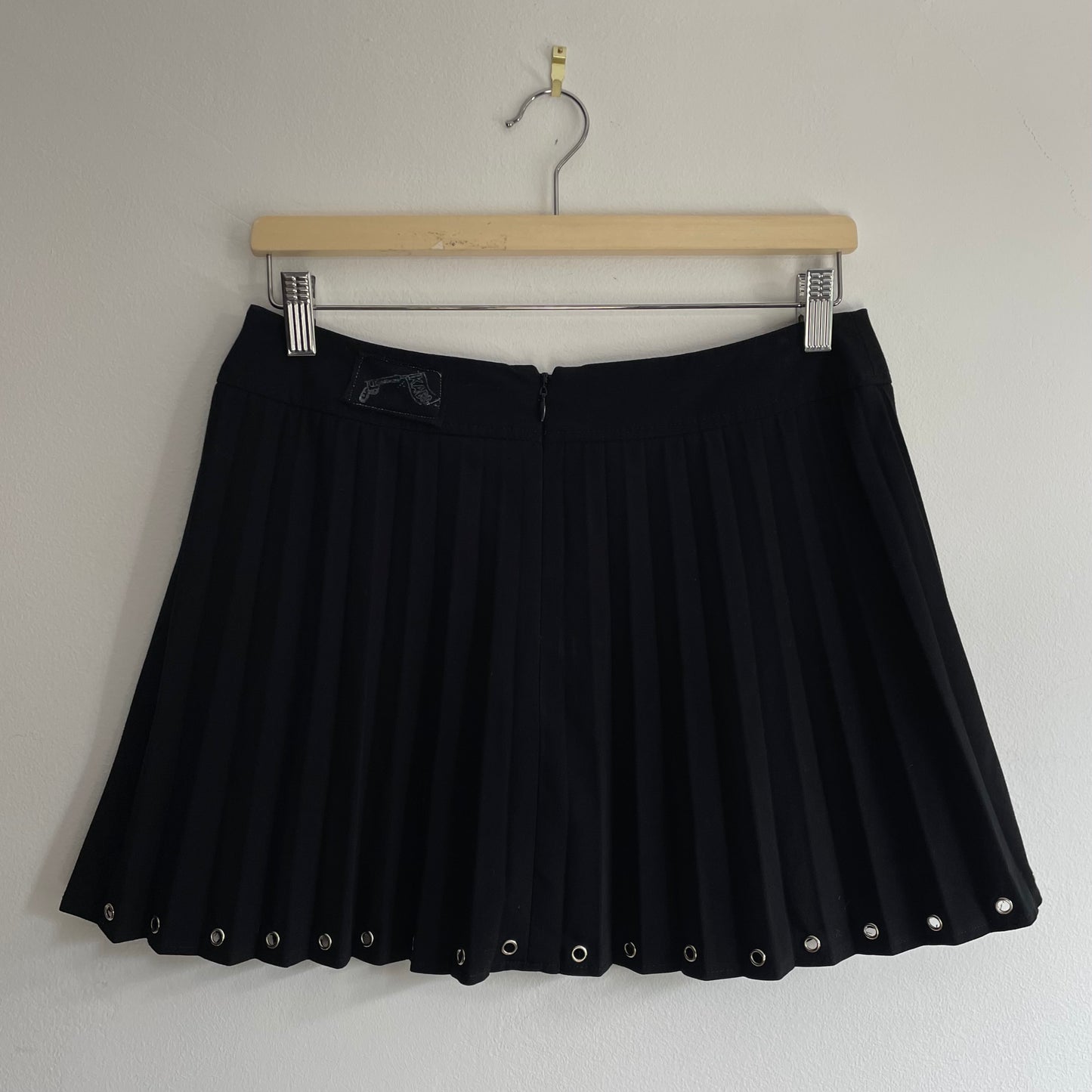 Mini pleated eyelet skirt