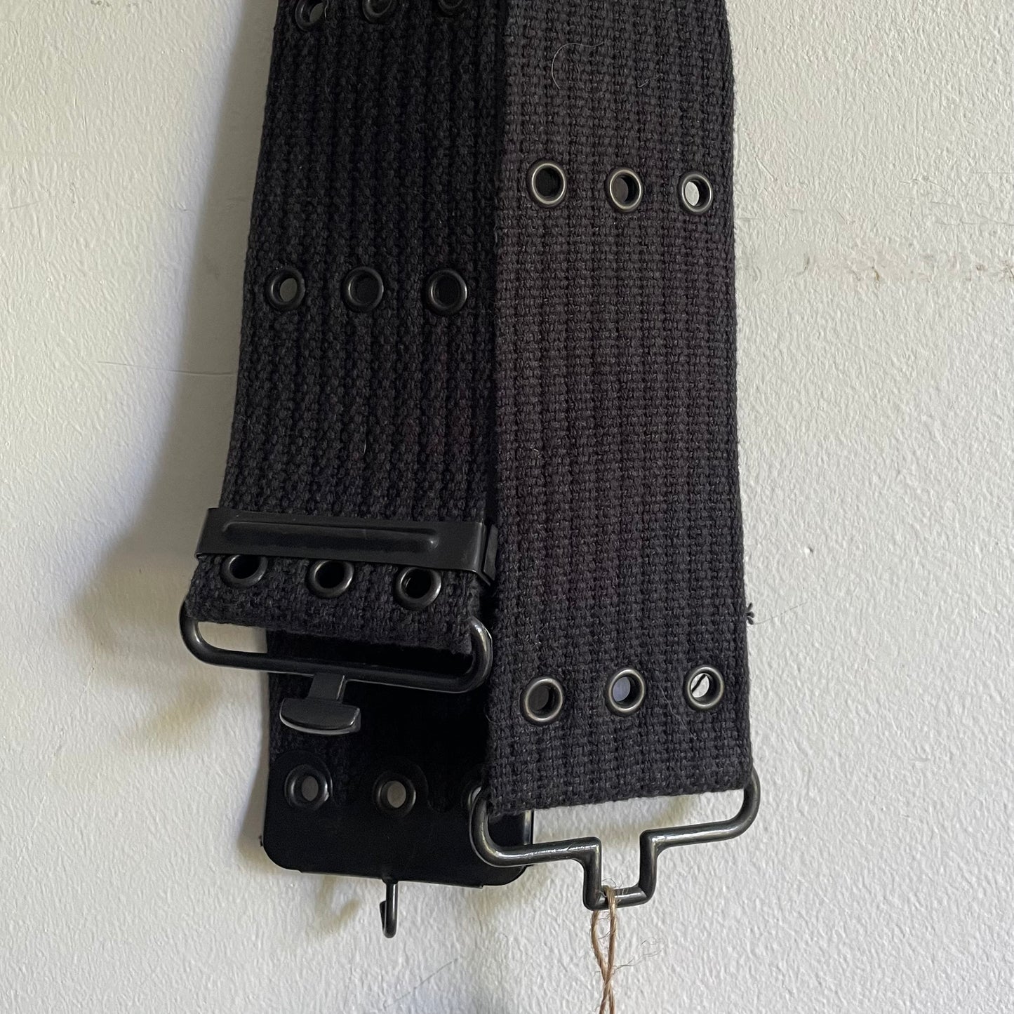 Triple eyelet belt