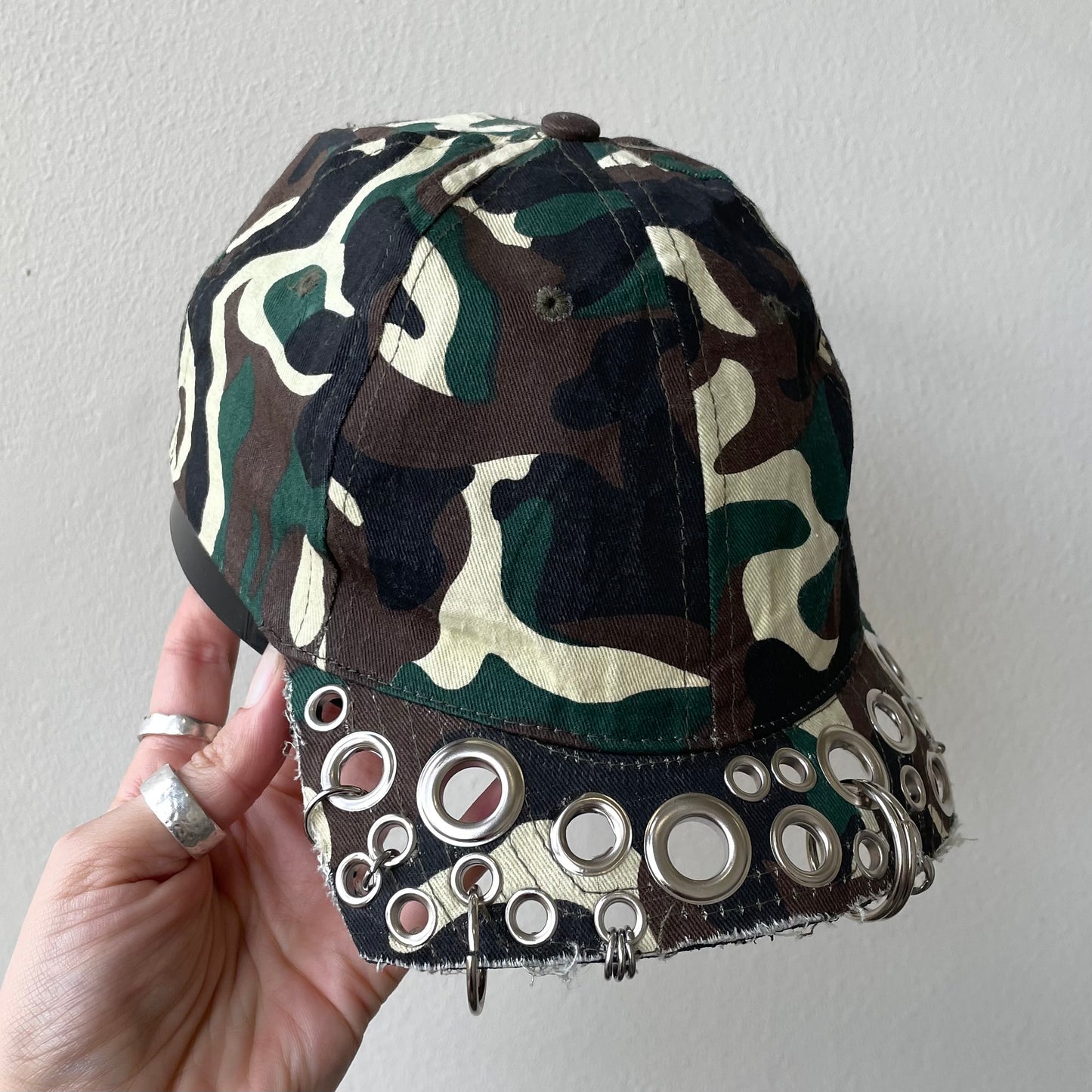 Camo eyelet brim cap
