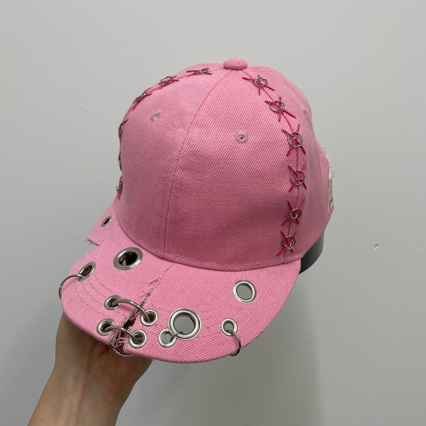 Pink cut out cap