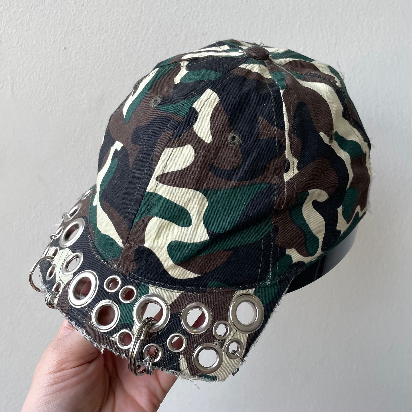 Camo eyelet brim cap