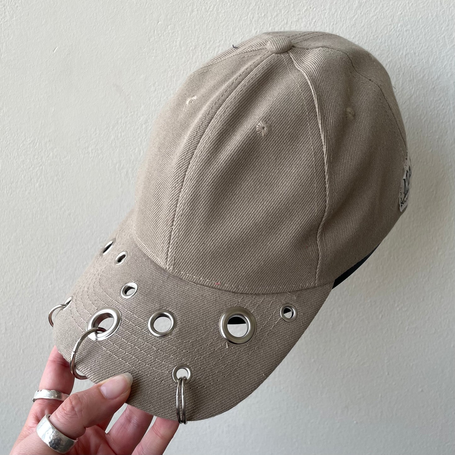 Beige eyelet cap