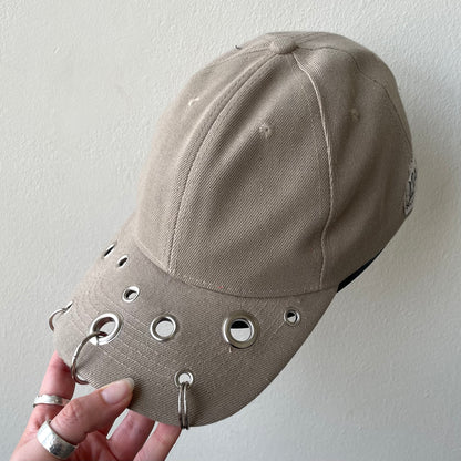 Beige eyelet cap