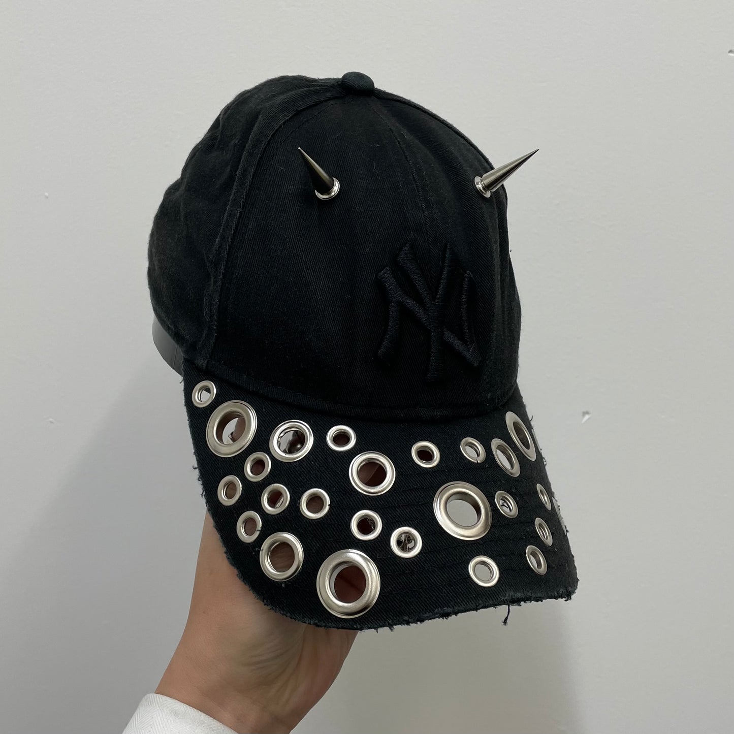 Eyelet brim cap