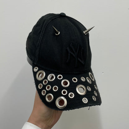 Eyelet brim cap