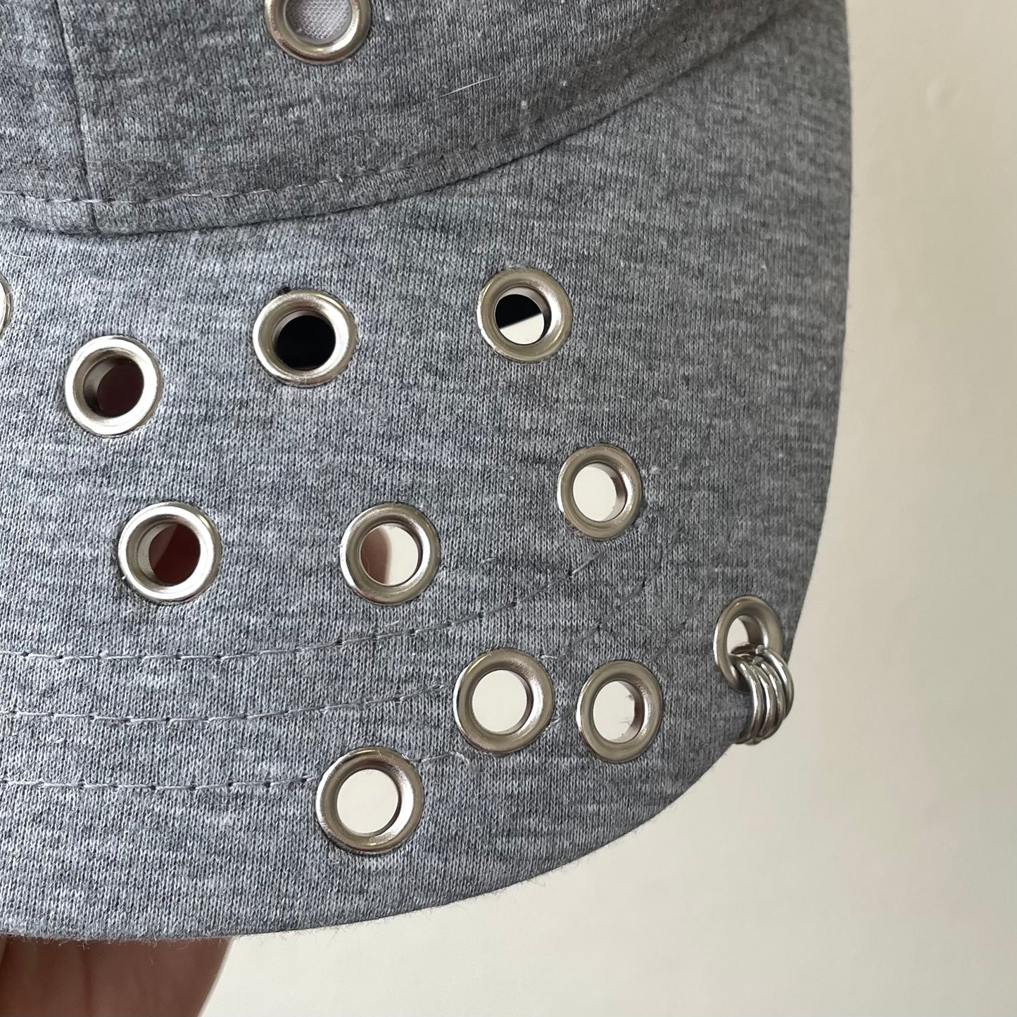 Grey eyelet cap